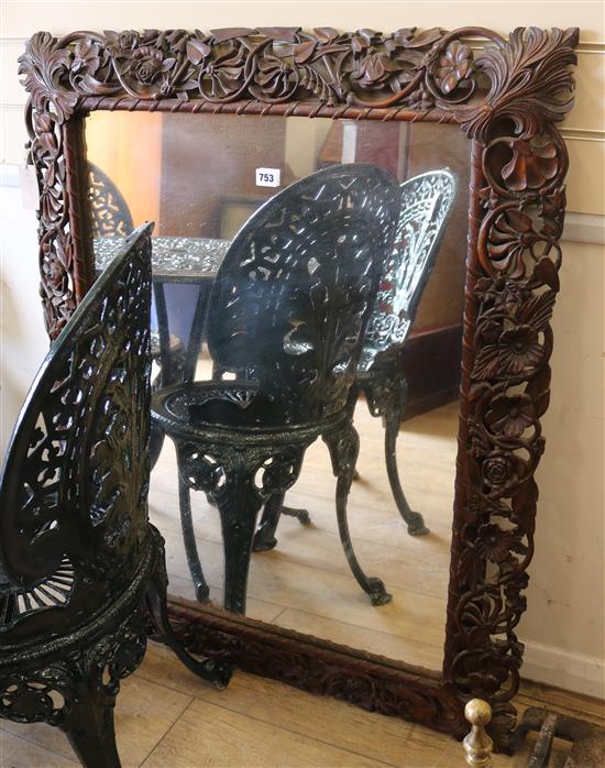 A carved oak framed mirror W.83cm